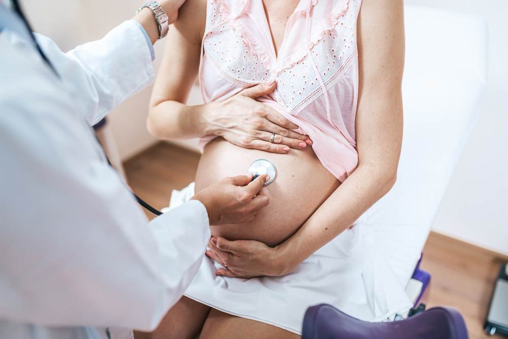 An obstetrics doctor checking a pregnant woman.