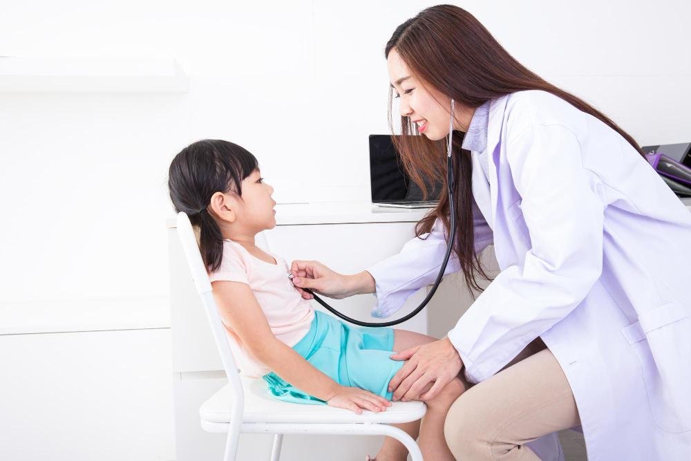 Doctor is checking a child